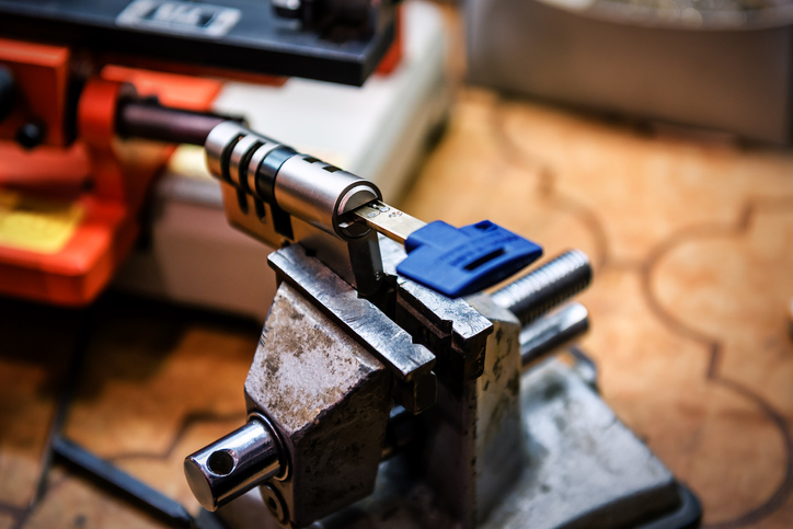 image shows a close-up of a locksmith's workbench